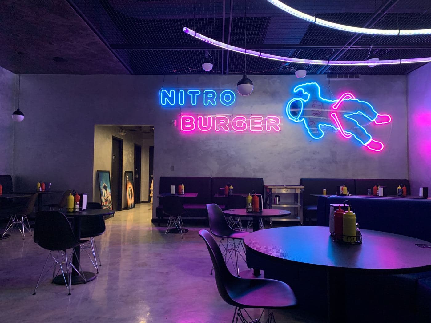 Nitro Burger interior with LED neon astronaut and lettering